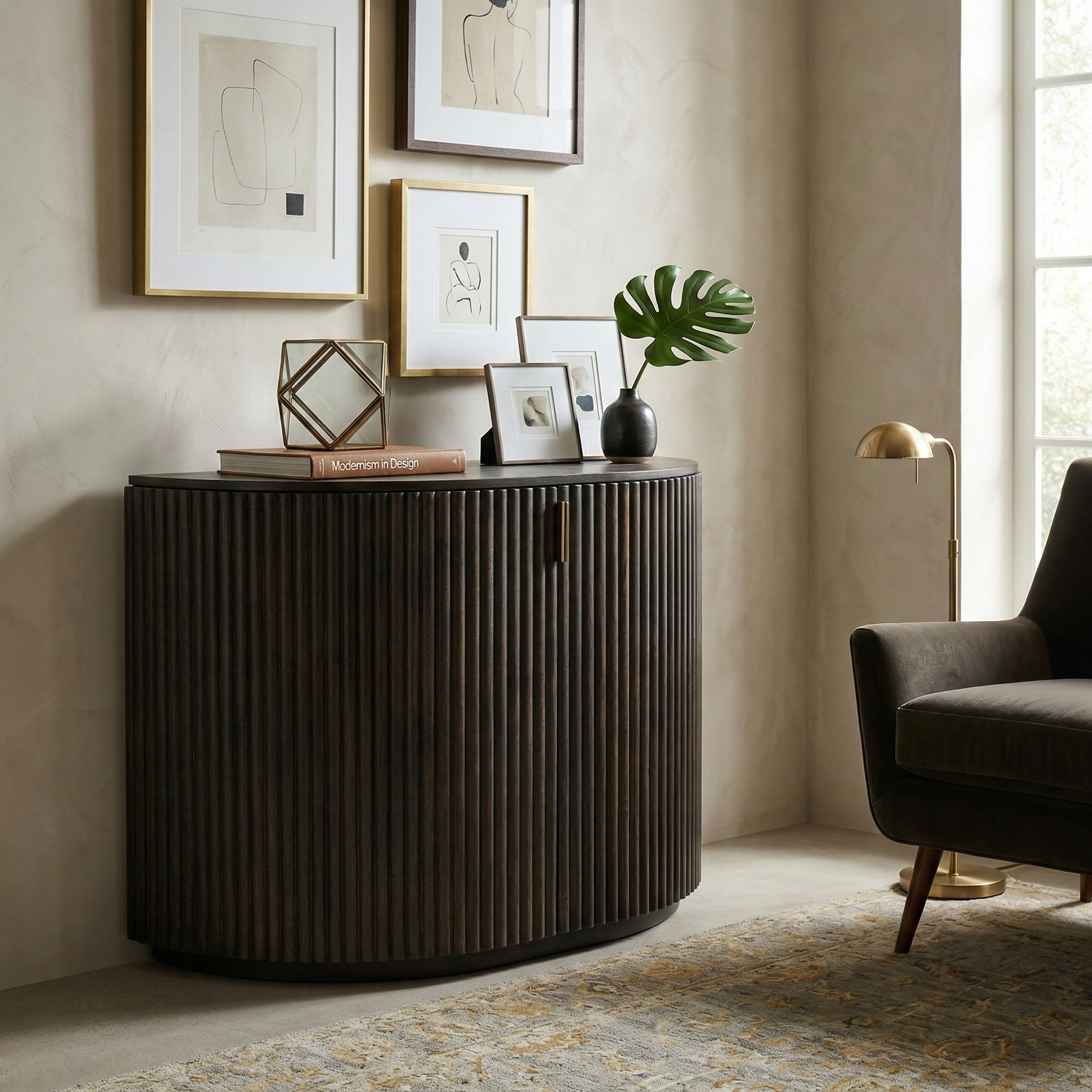 The dark wood Eleanor fluted accent cabinet styled in a cozy living room with art, decor, and an armchair.