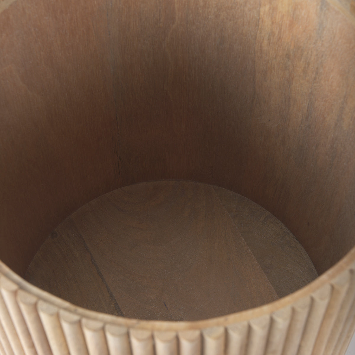 Top-down view inside the empty drum of the Eleanor fluted side table, showcasing its deep, hidden storage capacity.