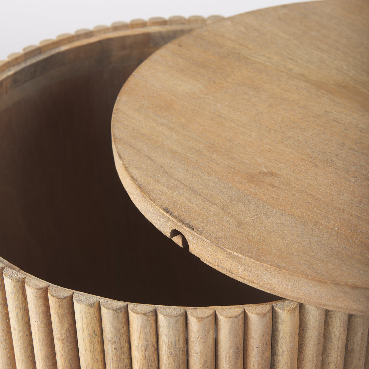 Close-up showing the removable wooden lid slightly ajar on the Eleanor round storage side table.