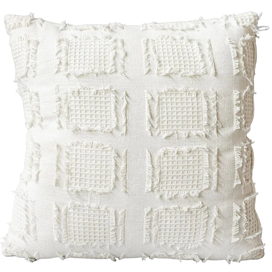 Textured white pillow on a gray background
