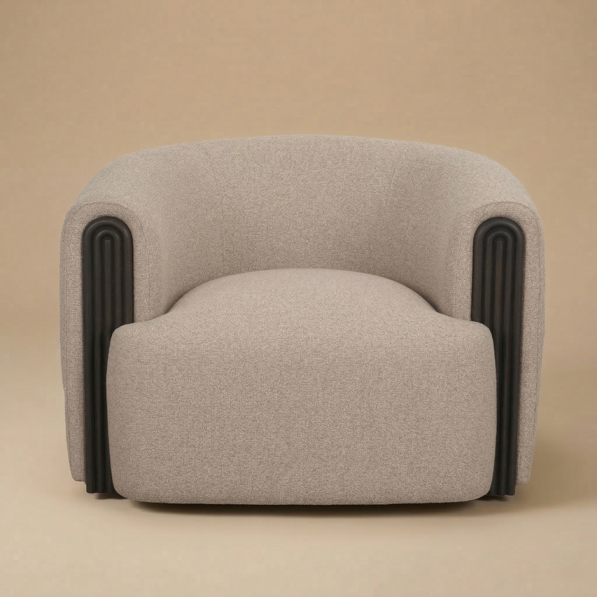 Full front view of the Elodie barrel chair in dark beige textured fabric with arched black fluted wood accents.