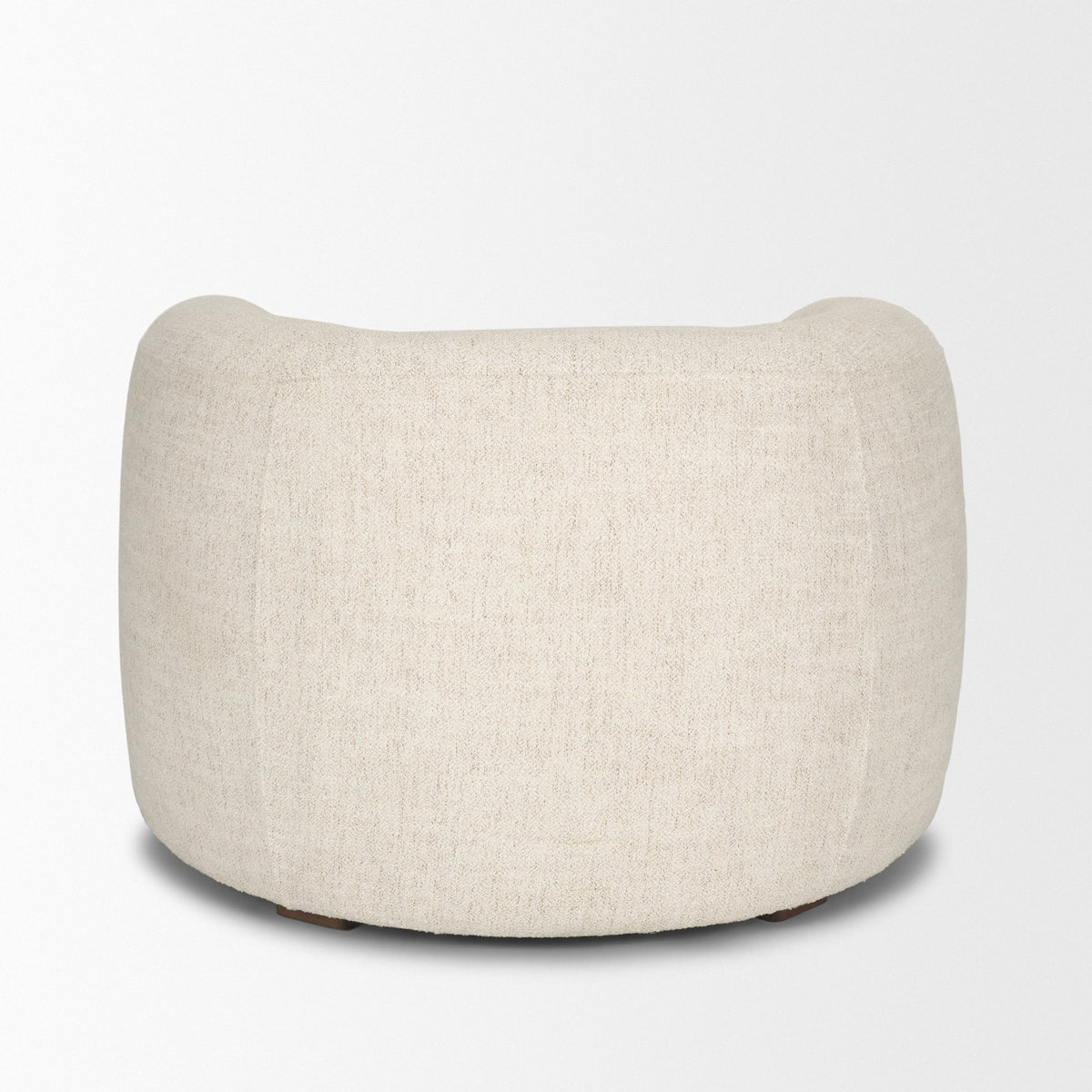 Back view of the Elodie barrel chair showcasing the continuous cream bouclé upholstery.