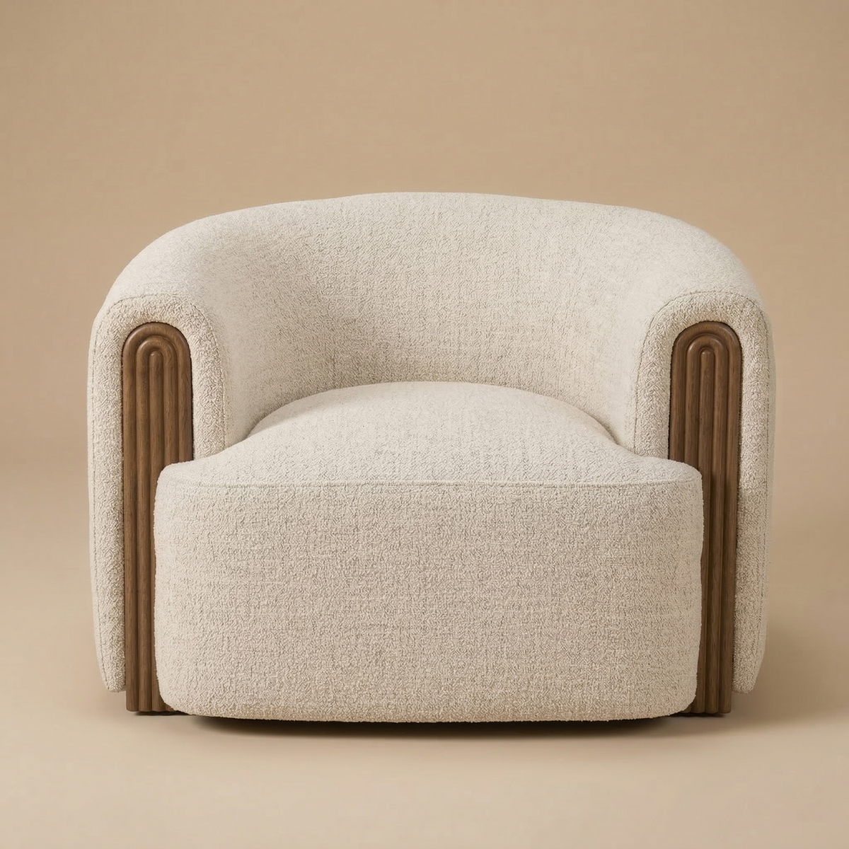 Full front view of the Elodie barrel chair featuring cream bouclé upholstery and arched fluted wood arm accents.