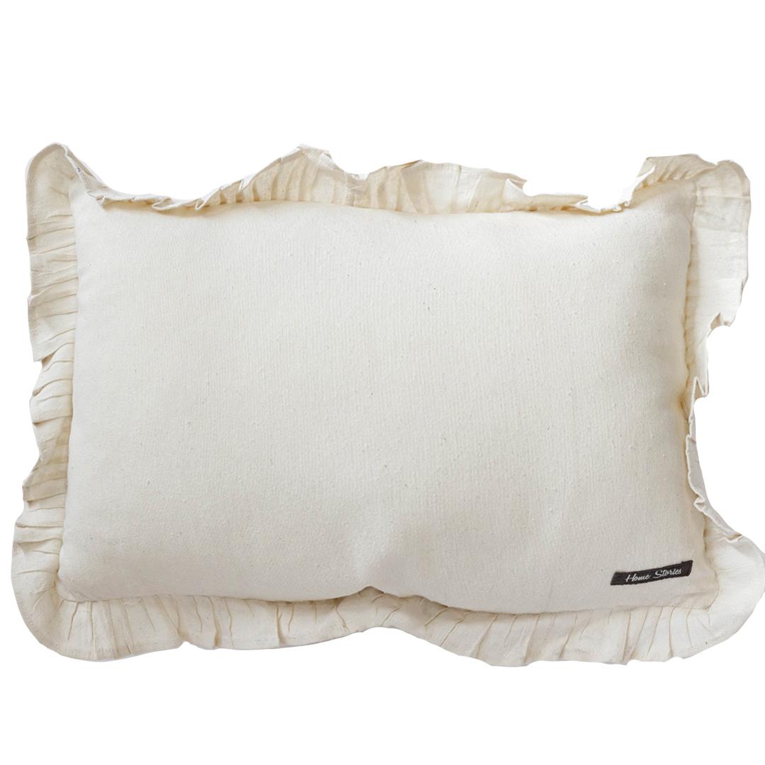 White pillow with ruffles edge on a white background
