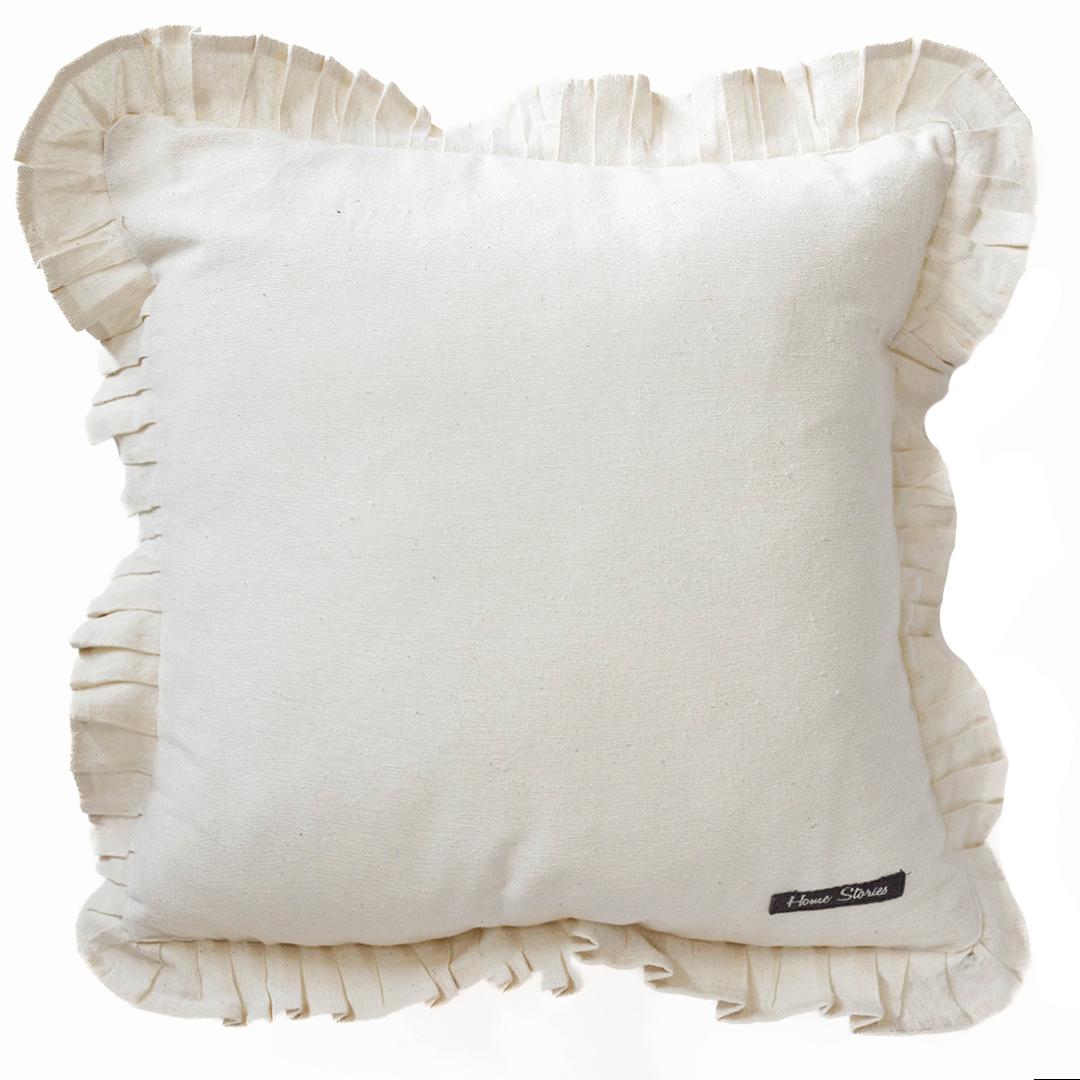 White pillow with ruffles edge on a white background
