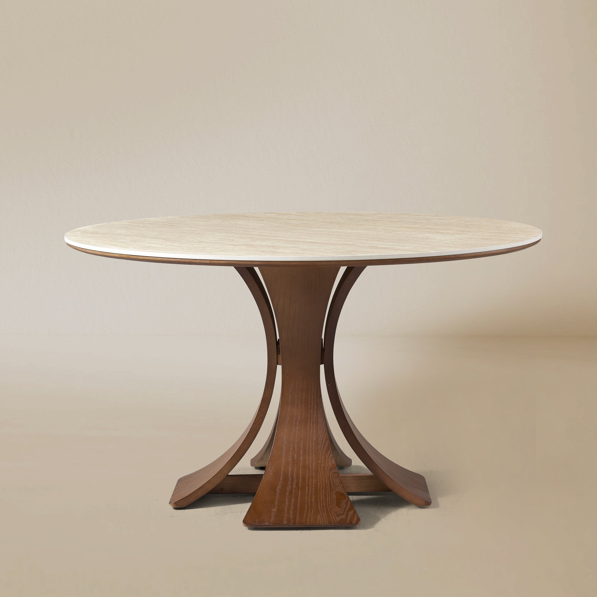 Elowen Round Dining Table with white top and sculpted walnut base against neutral beige background