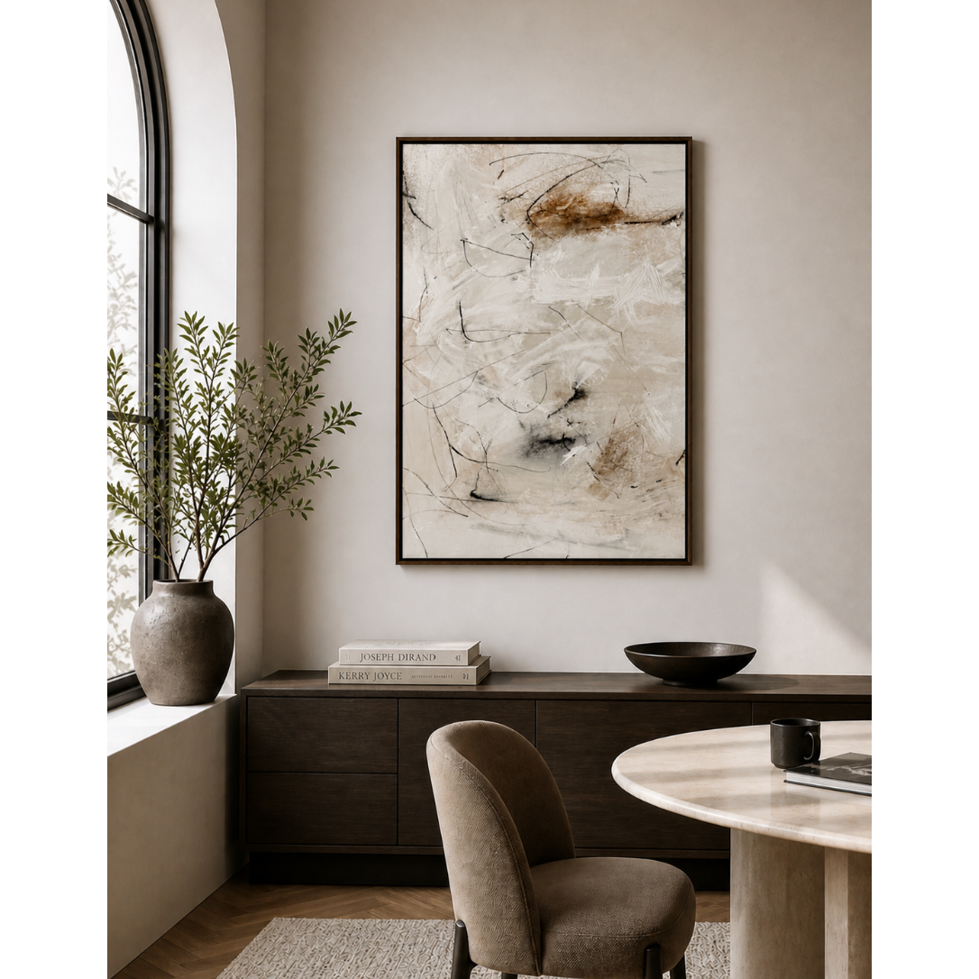Modern interior with abstract art, desk, and chair.