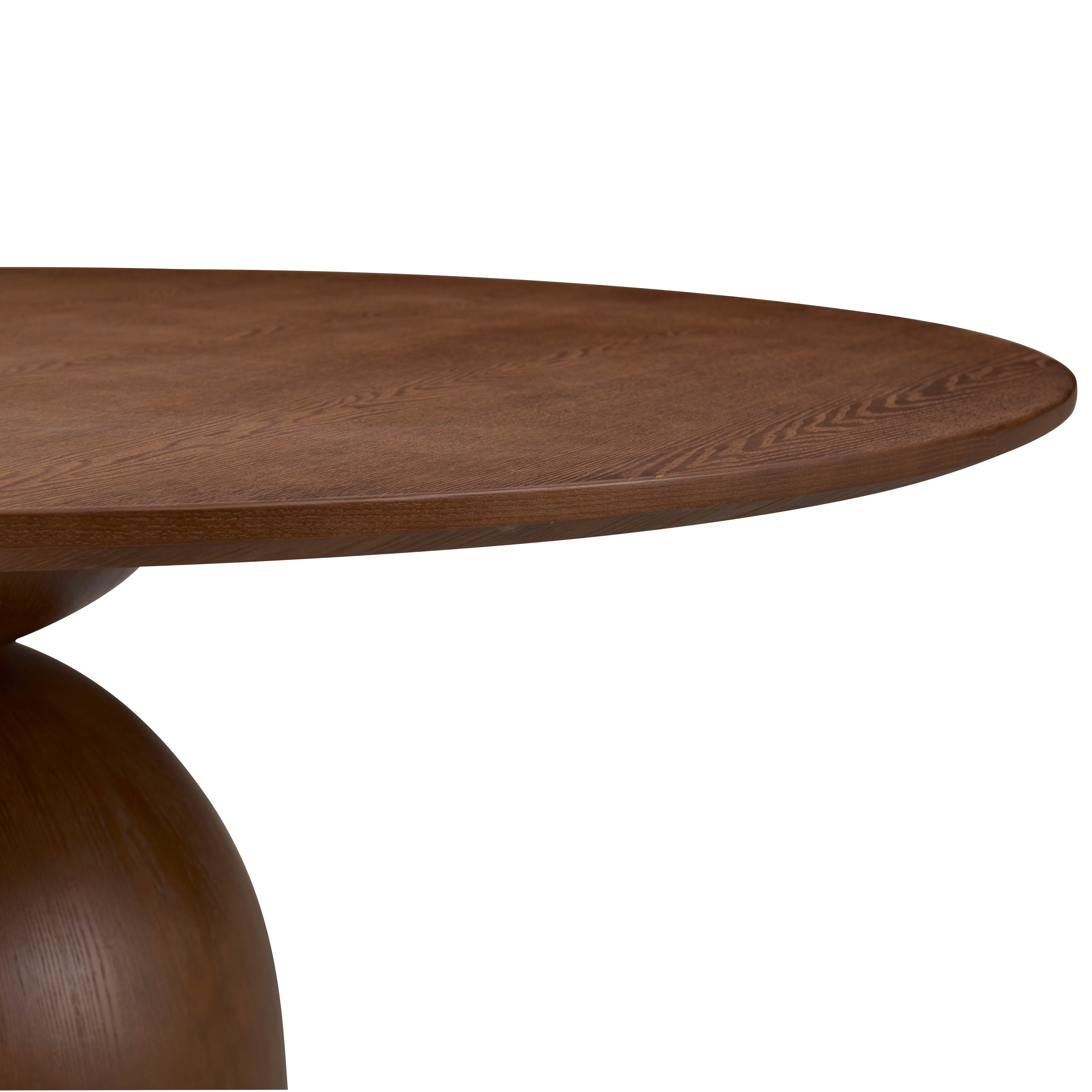 Close-up of the Evelyn Dining Table’s rounded wood tabletop edge