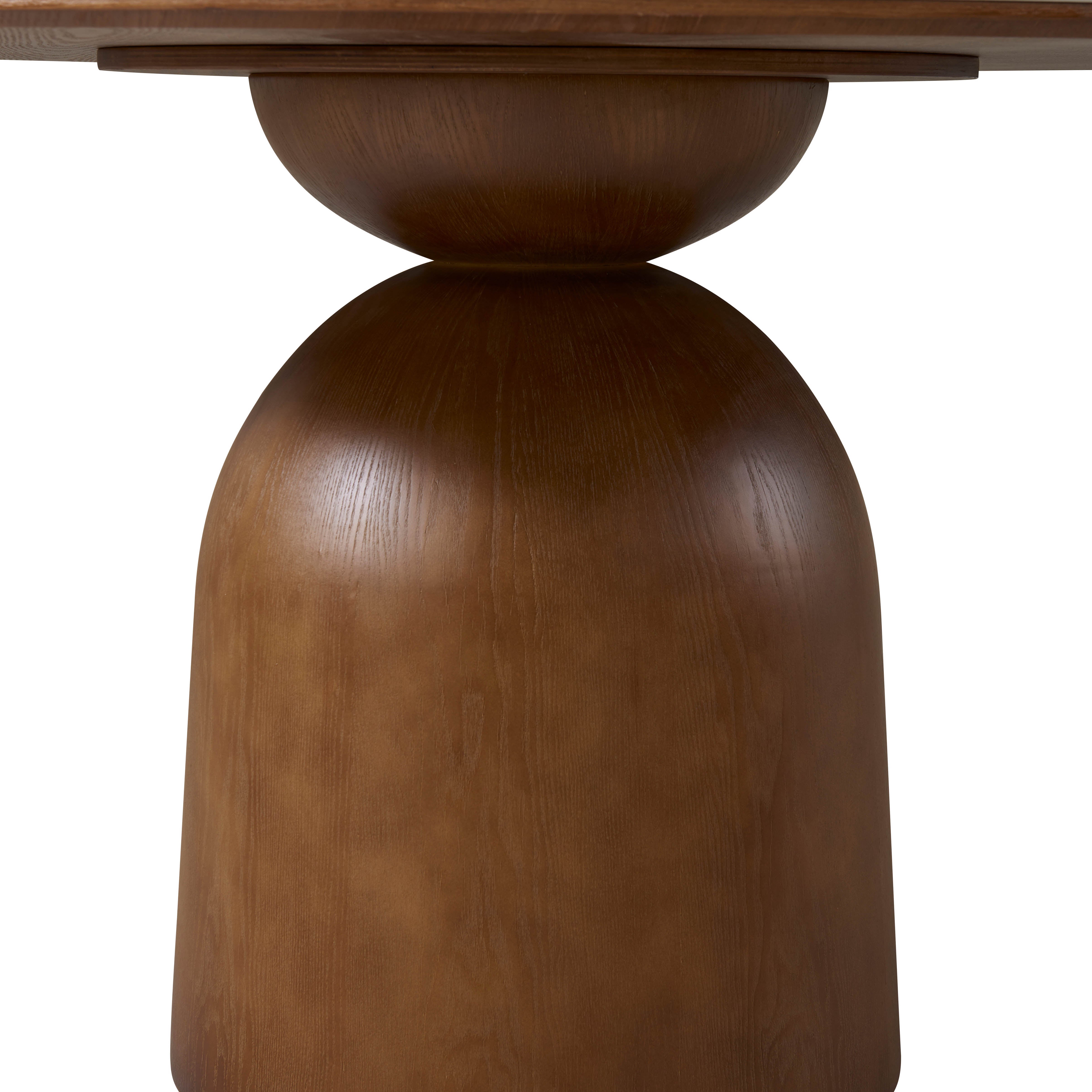 Sculptural solid wood pedestal structure of the Evelyn Dining Table