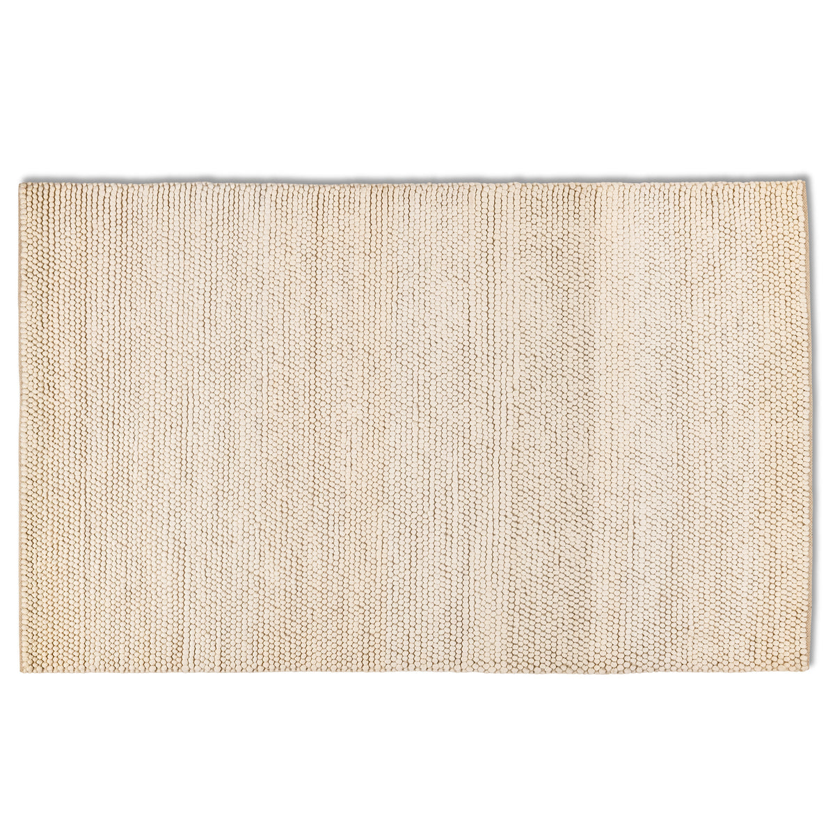 Full overhead view of the rectangular cream ivory Felix handmade textured rug featuring a chunky, bobbled surface.
