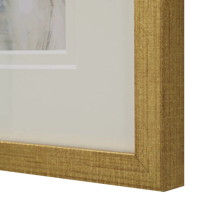 Macro close-up of the distressed, textured gold frame and clean white matting on the Florence framed wall art.