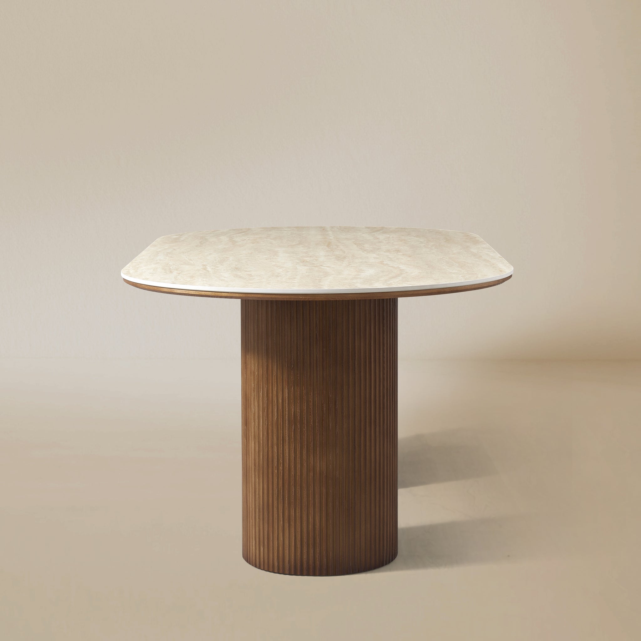 Wood base side view of the Gianna dining table with oval top and dual wood pedestal base on beige studio background