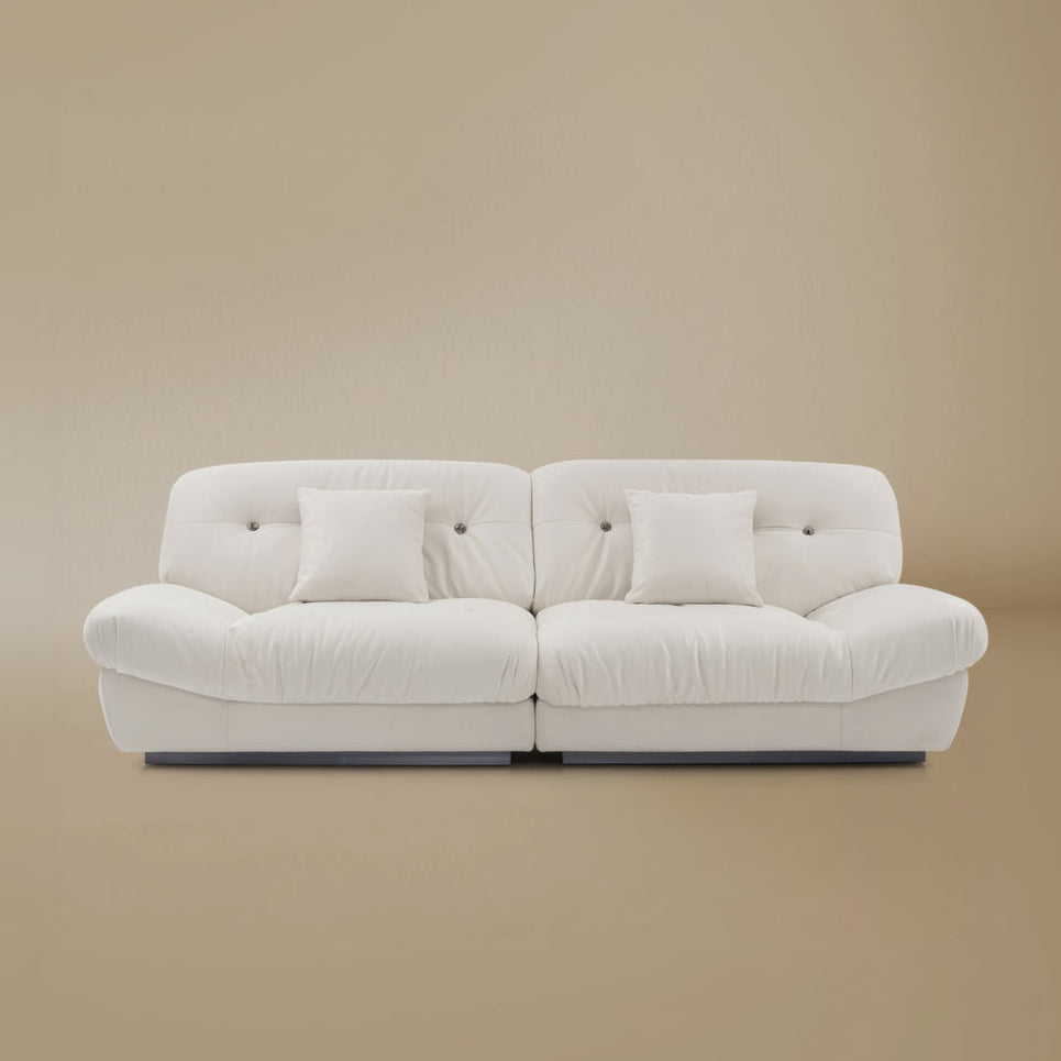 Front view of the Italian Style Cloud Sofa in a light beige studio background