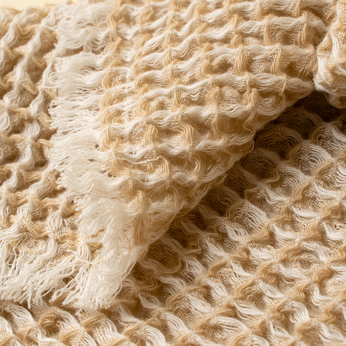 Close-up of beige textured fabric