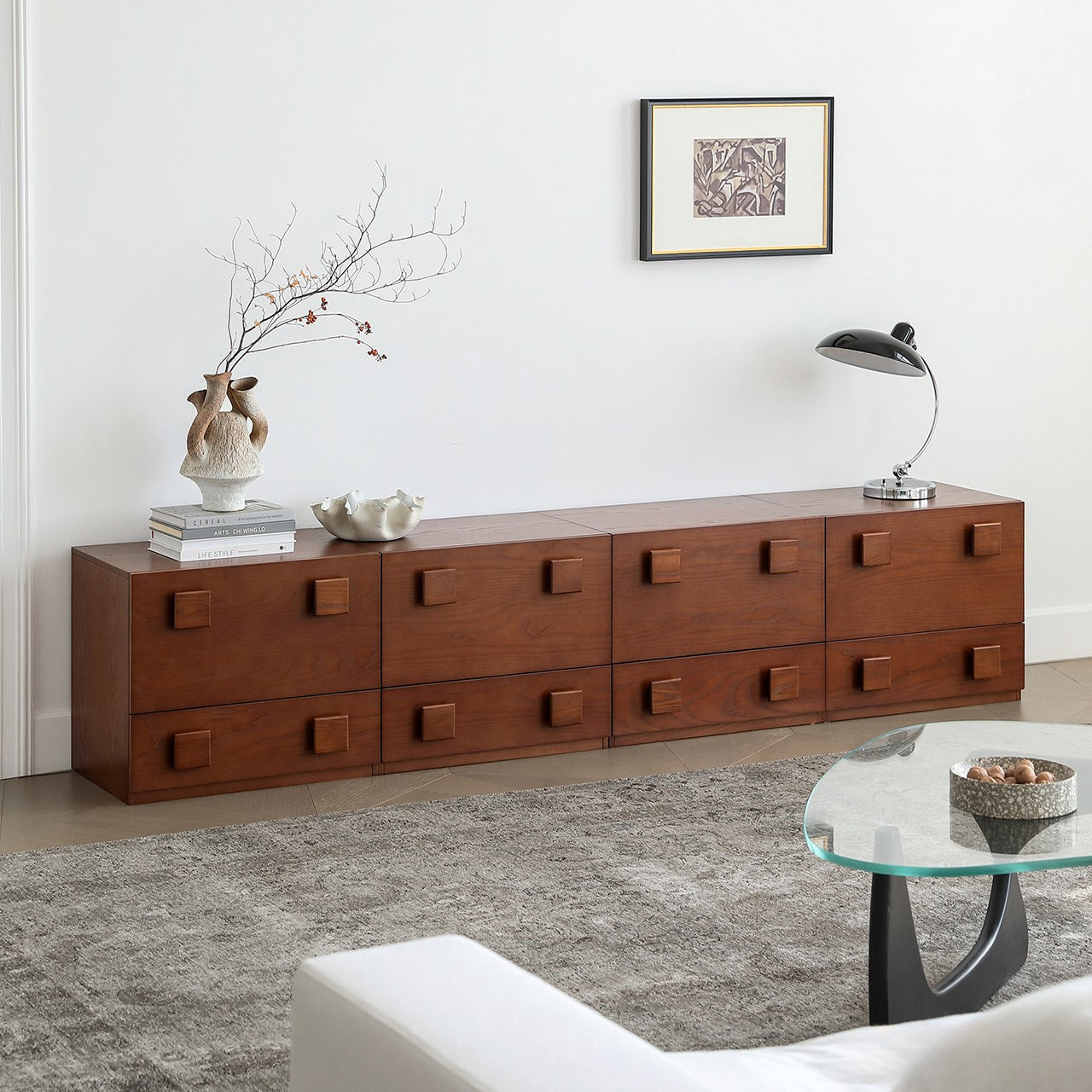 Jasper Modular Sideboard in a long low configuration with walnut finish and square drawer handles in a modern living room.