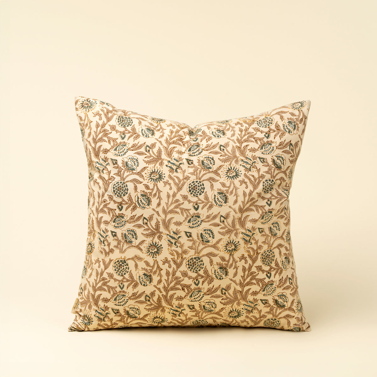Decorative pillow with floral pattern on a beige background