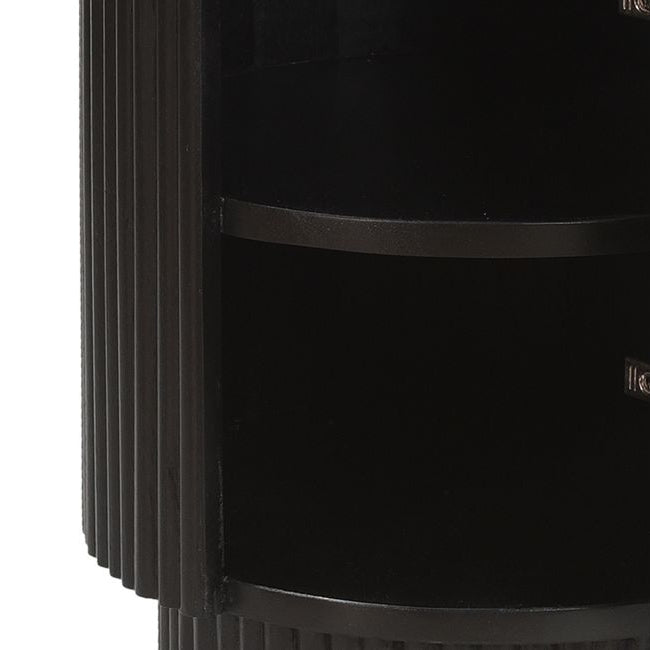 Black cylindrical Kaia accent table with a fluted base on a white background