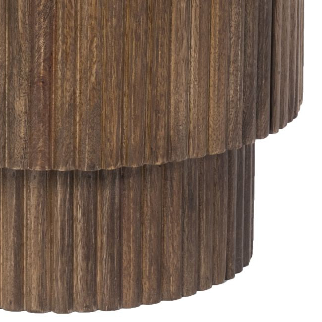 Wooden cylindrical base with a fluted texture on a white background