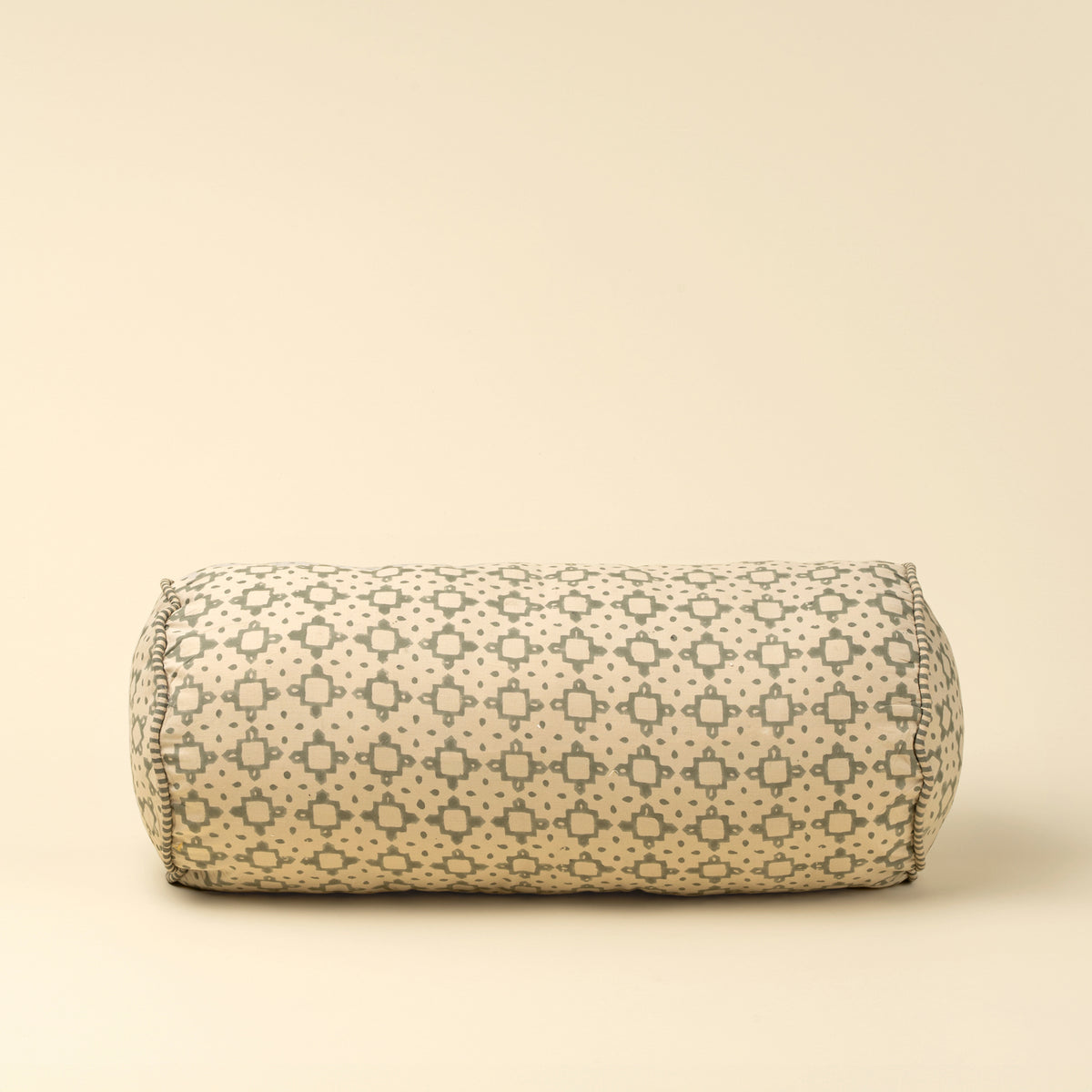 cylindrical fabric product with a geometric pattern on a beige background