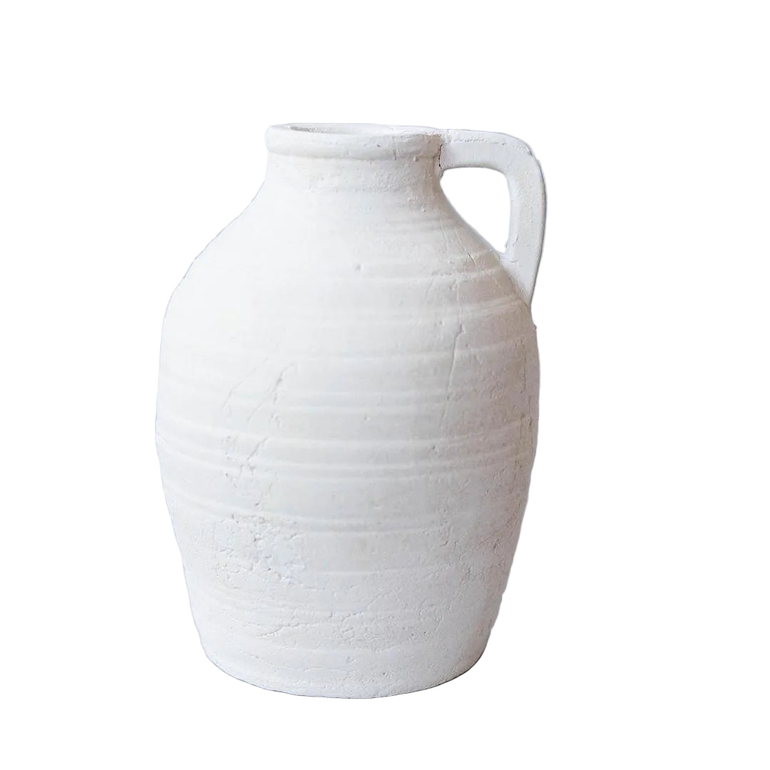White ceramic vase with a handle on a light gray background