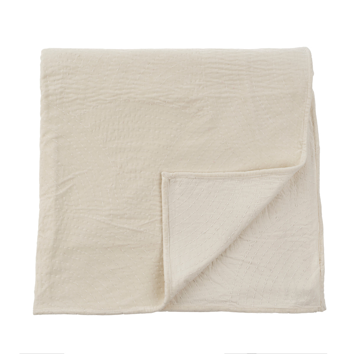 Beige quilted blanket on a white background