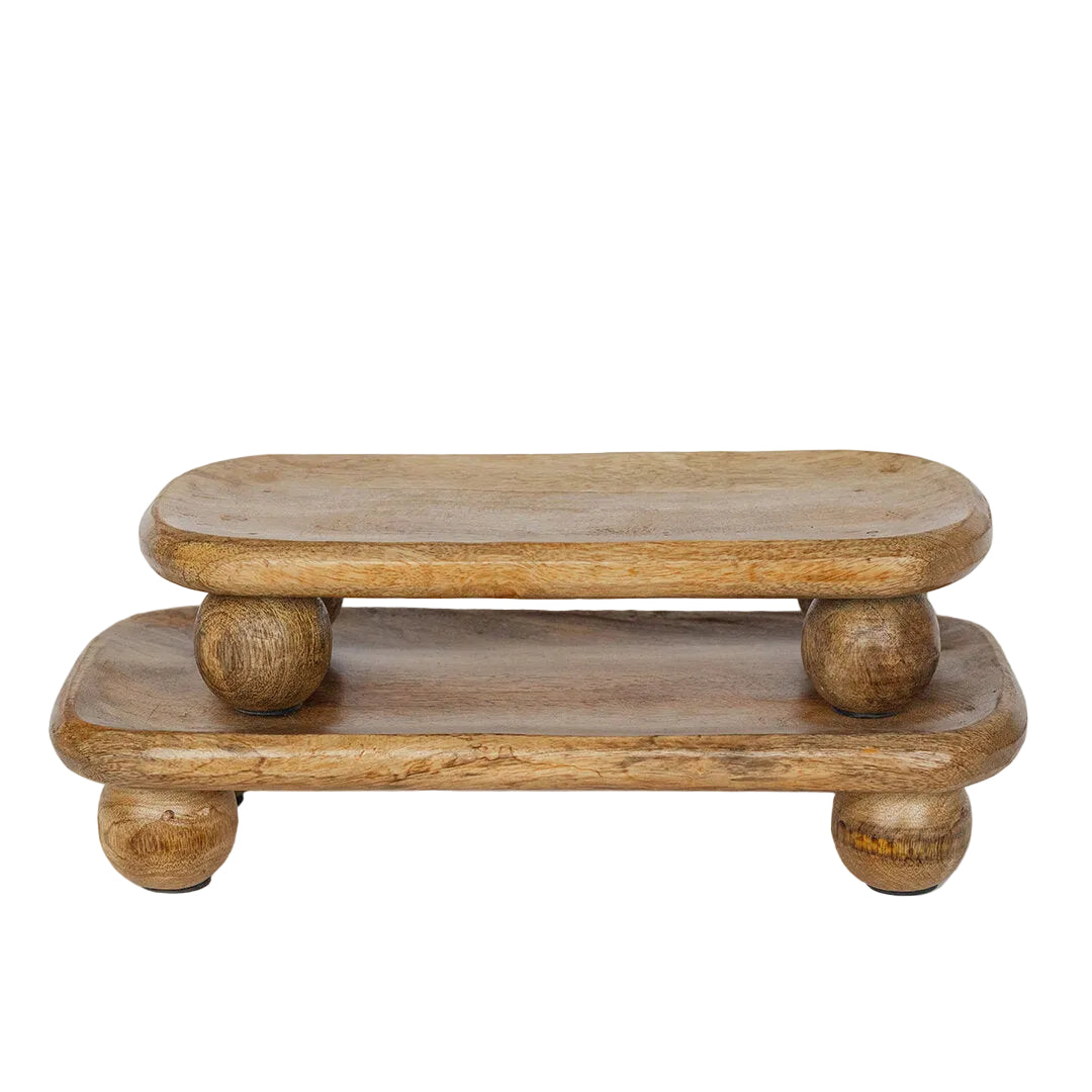 Wooden two-tiered table with round legs on a white background