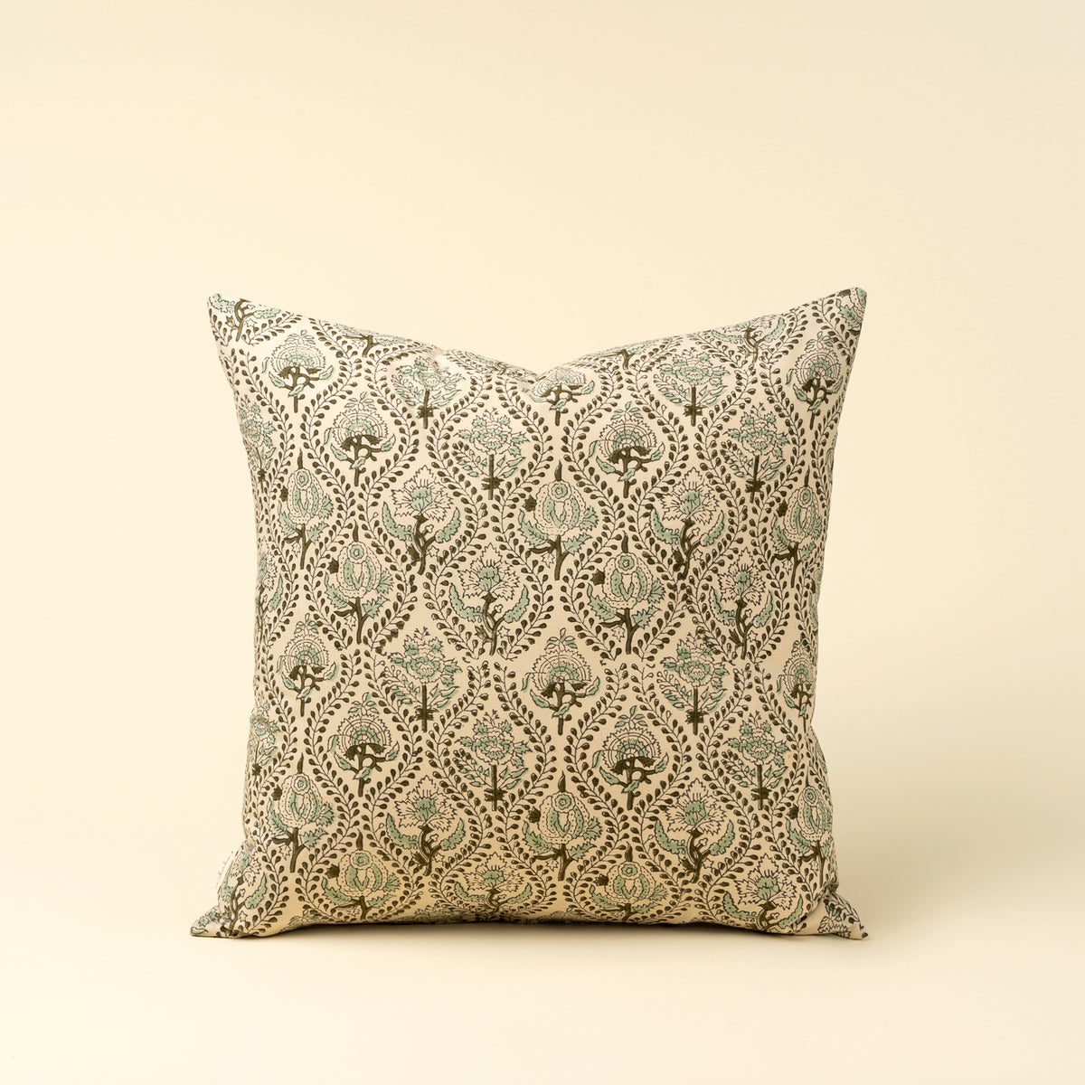 Decorative pillow with a floral pattern on a beige background