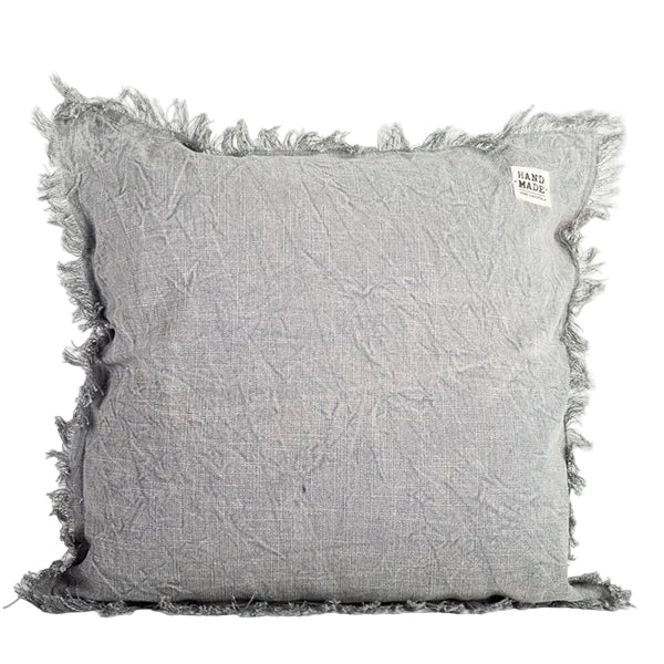 Gray textured pillow with fringes on a white background
