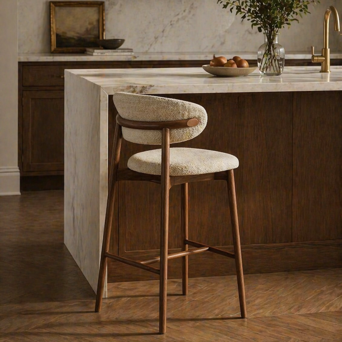 Bar stools with wooden legs and cushioned seats in a kitchen setting.
