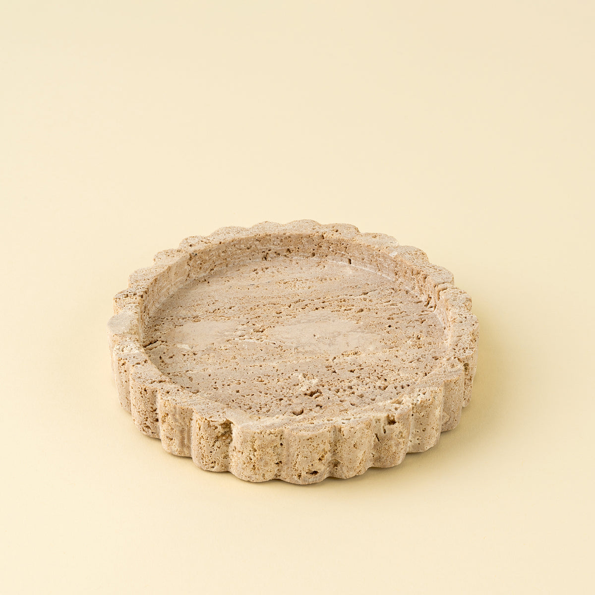Decorative stone bowl on a beige background