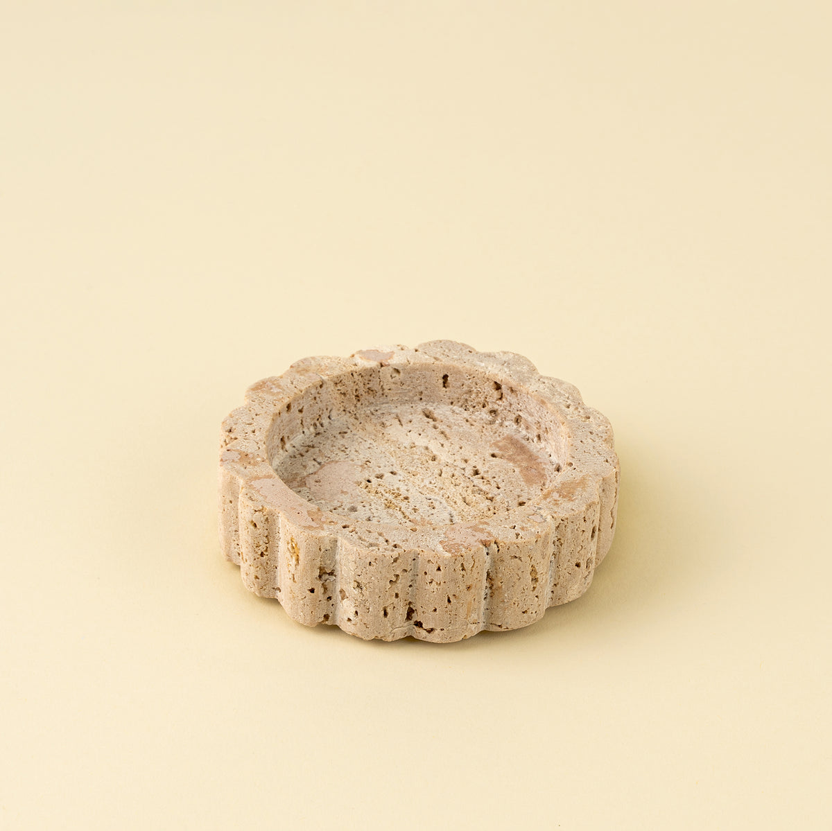 Decorative stone bowl on a beige background