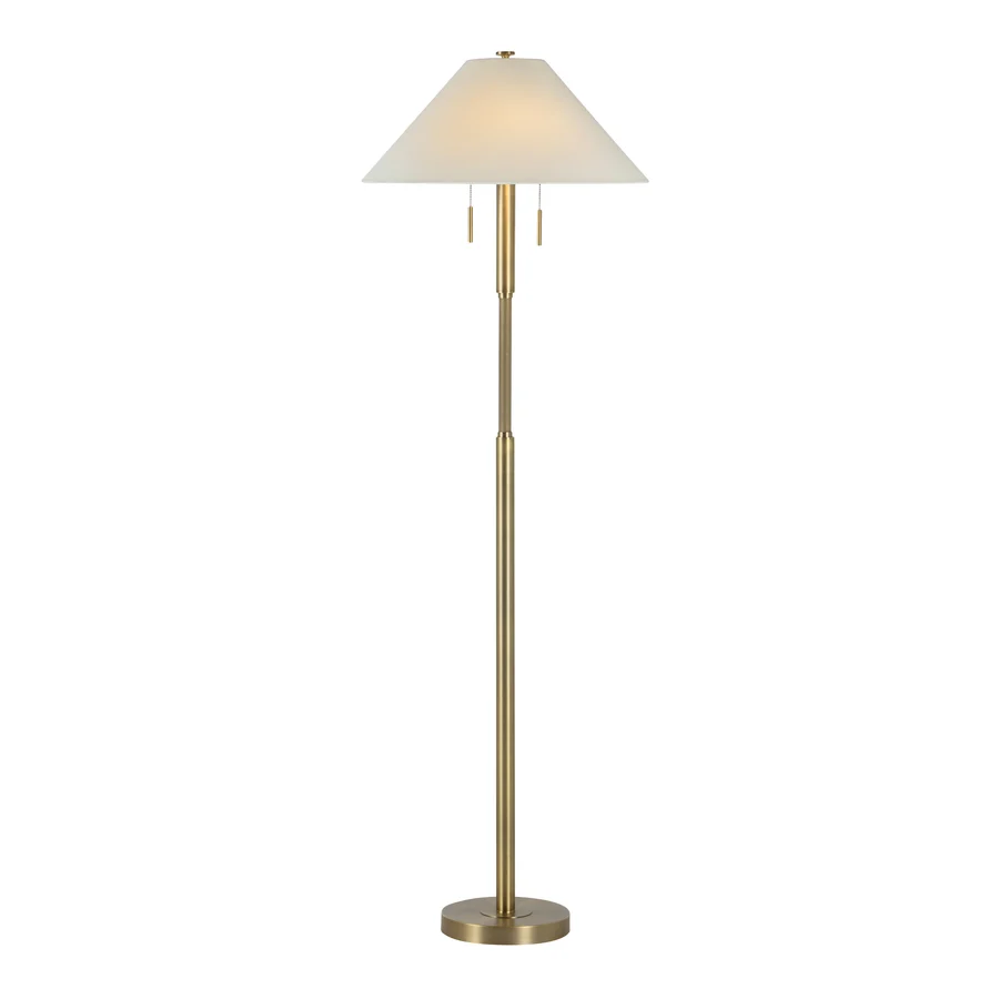 Lucienne Antique Brass Floor Lamp illuminated to show the warm glow through its off-white linen shade.
