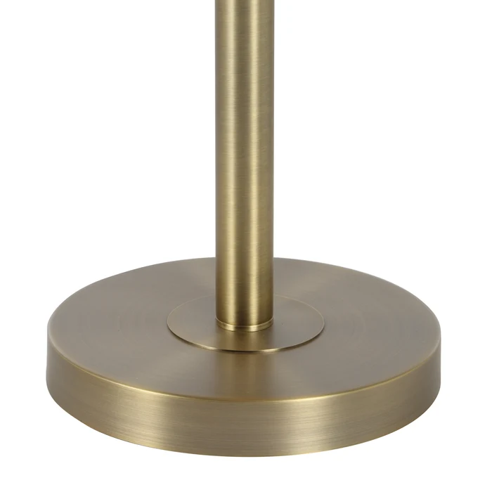 Close-up of the Lucienne floor lamp's round iron base in a dark antique brushed brass finish.
