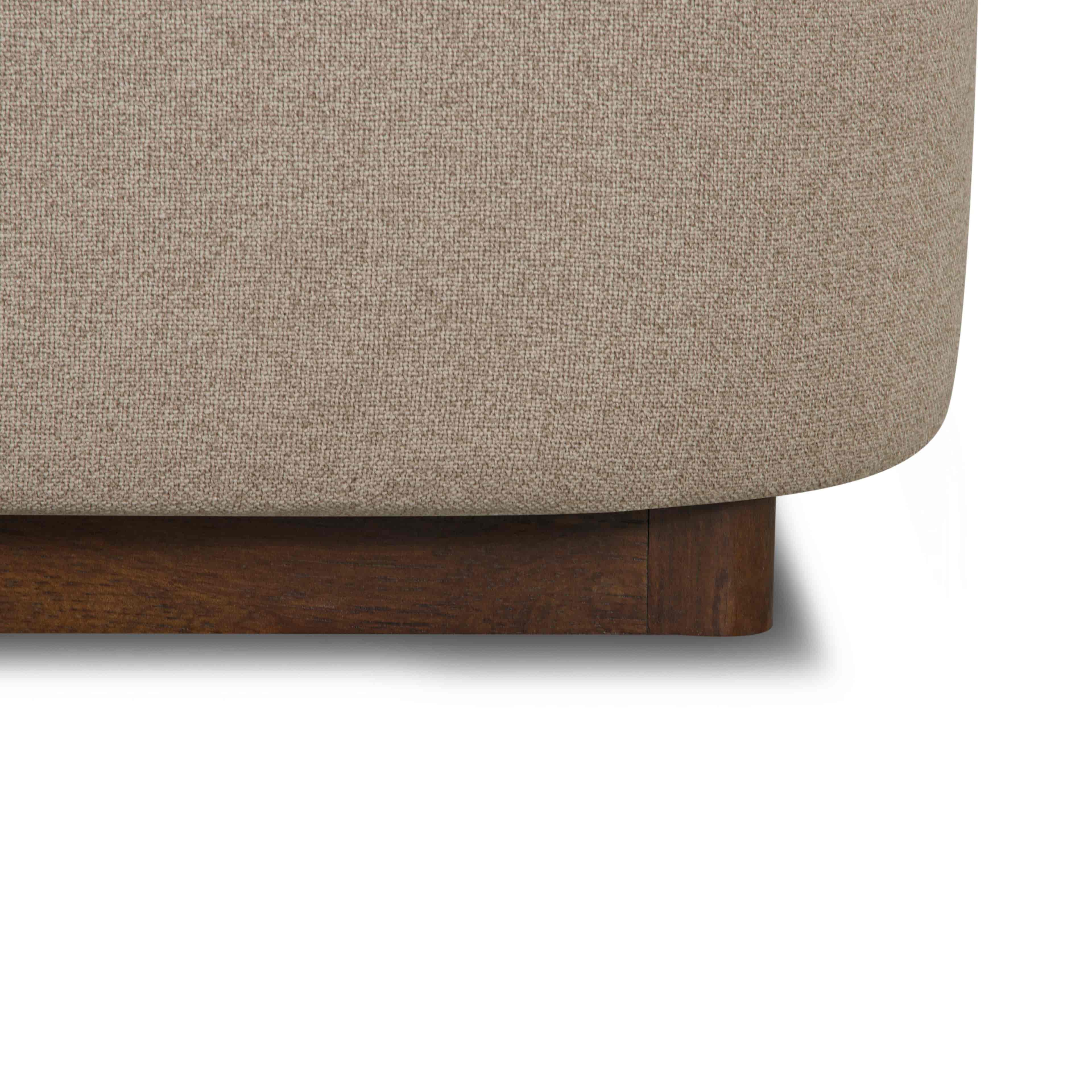 Close-up of the Lunelle Velvet Bed with a wooden base on a white background