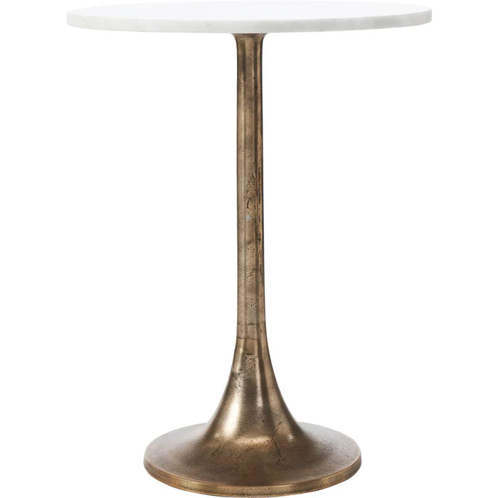 Small round table with a white marble top and bronze metal base on a white background