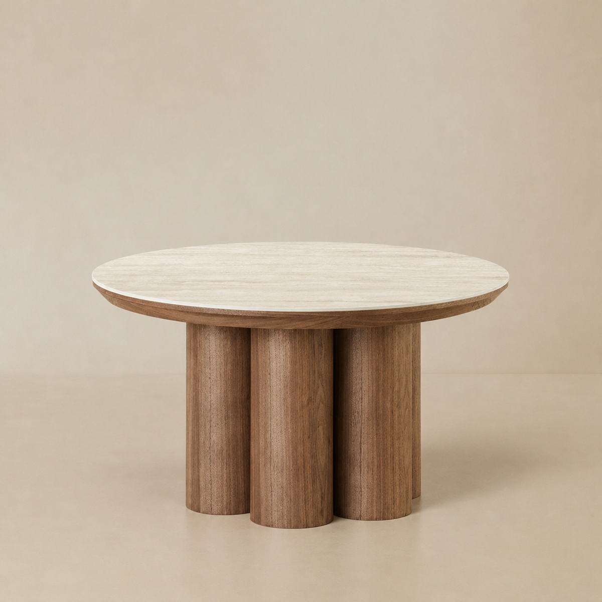 Full view of the Lyric coffee table featuring a round cream sintered stone top and walnut finish clustered cylinder base.