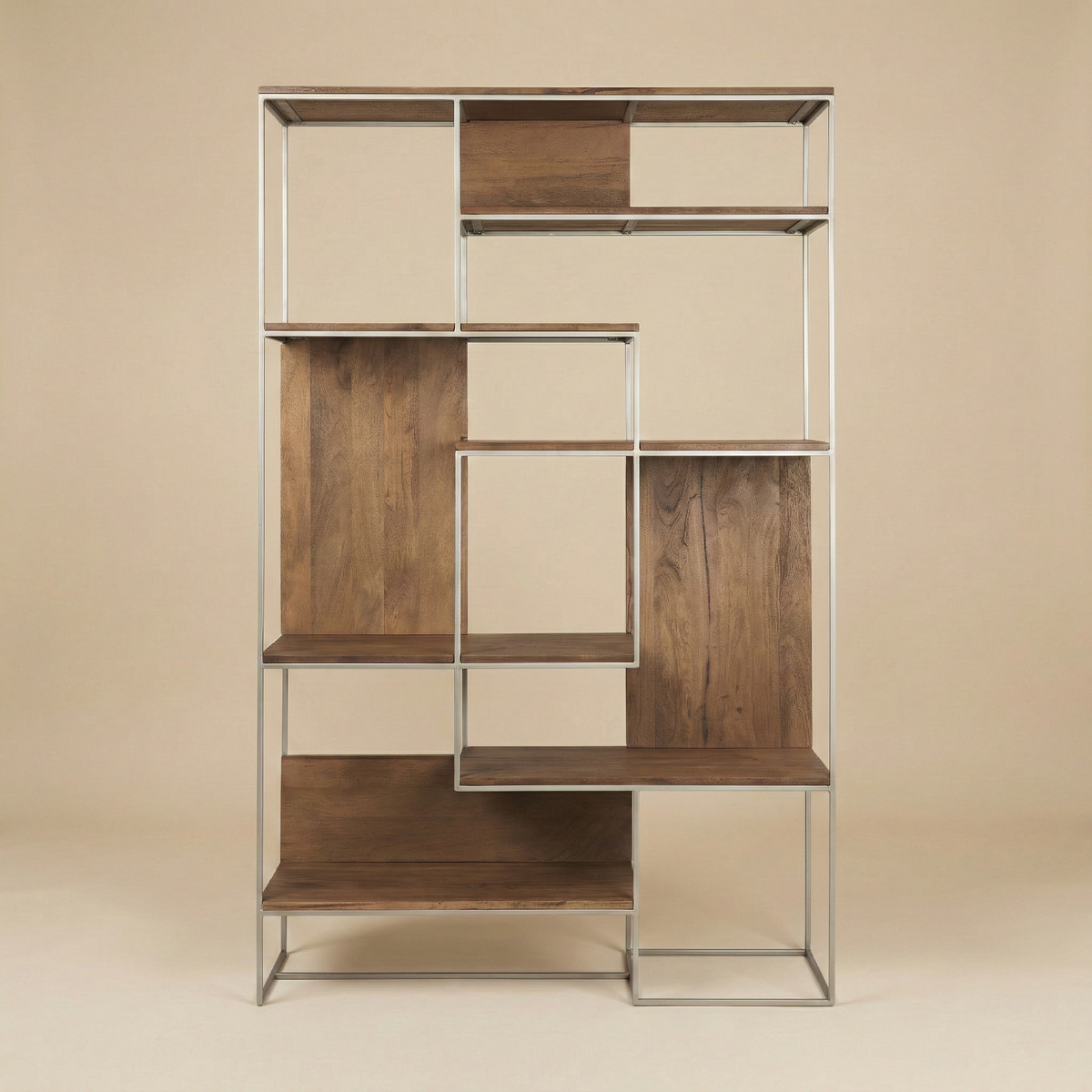 Full front view of the empty Maddox geometric shelving unit featuring an asymmetrical wood and metal frame design.