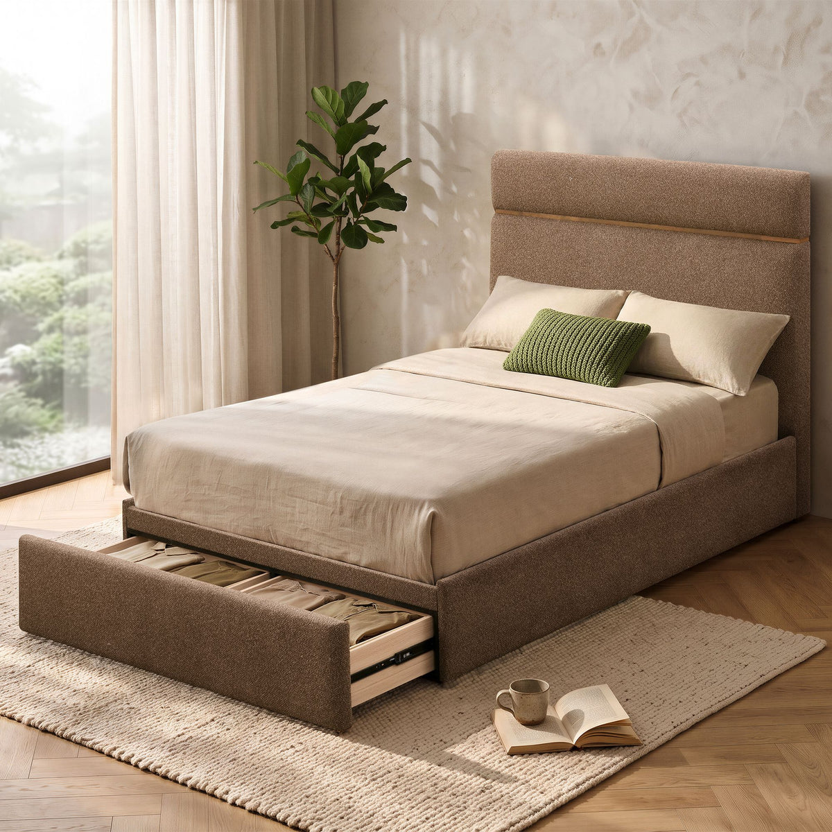 Maelle Upholstered Storage Bed styled with neutral bedding and green accent pillows in a bedroom, with the footboard storage drawer open.