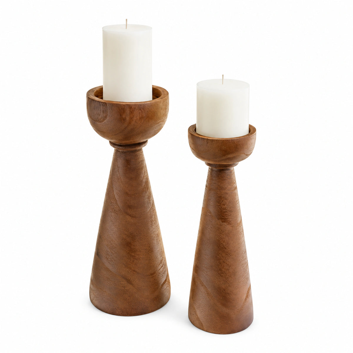Marlow tall and short medium brown paulownia wood candle holders with white pillar candles on a white background.