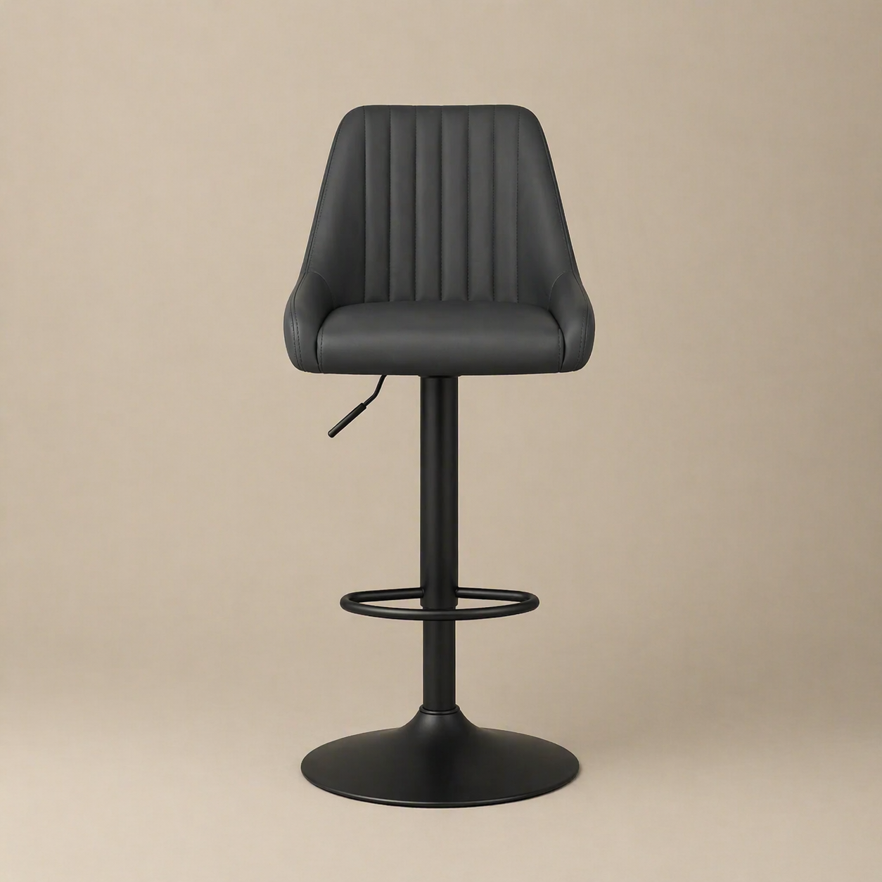 Black bar stool with quilted seat on a beige background