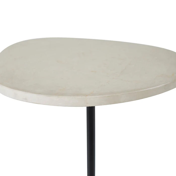 Round marble table with a black leg on a white background