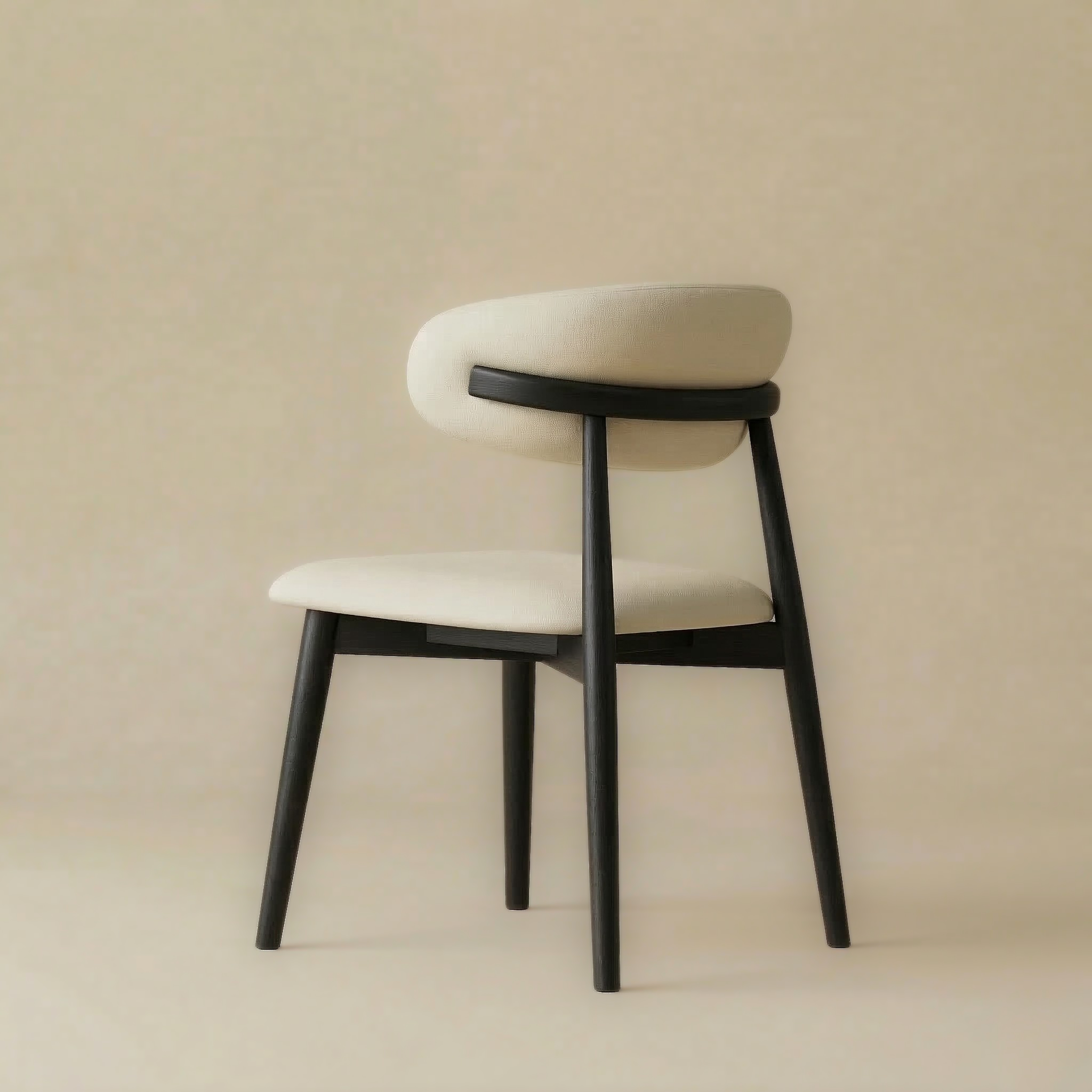 Back angled view of the Modern Leather Ash Wood Dining Chair revealing the solid black wood support bar cradling the cream upholstered backrest.