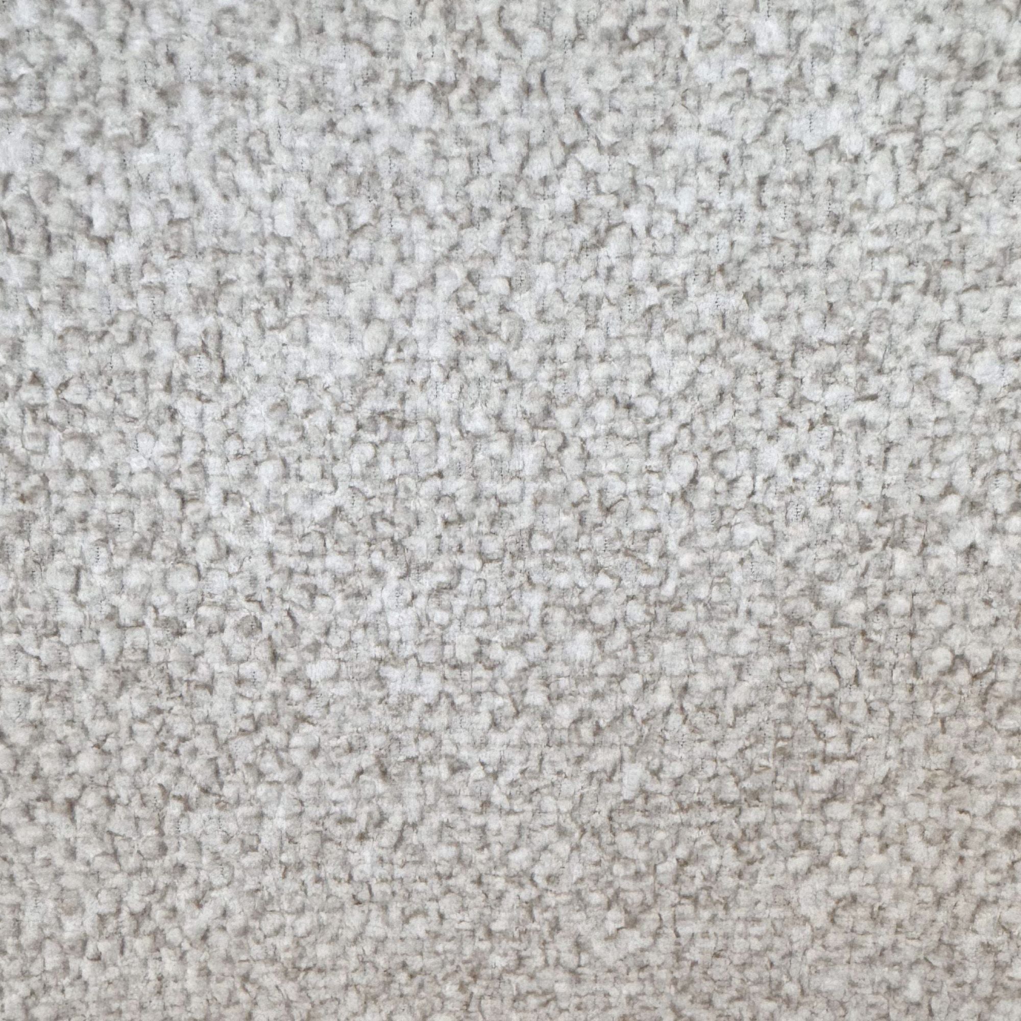 Macro close-up of the soft, speckled beige textured bouclé fabric on the Myla dining chair.
