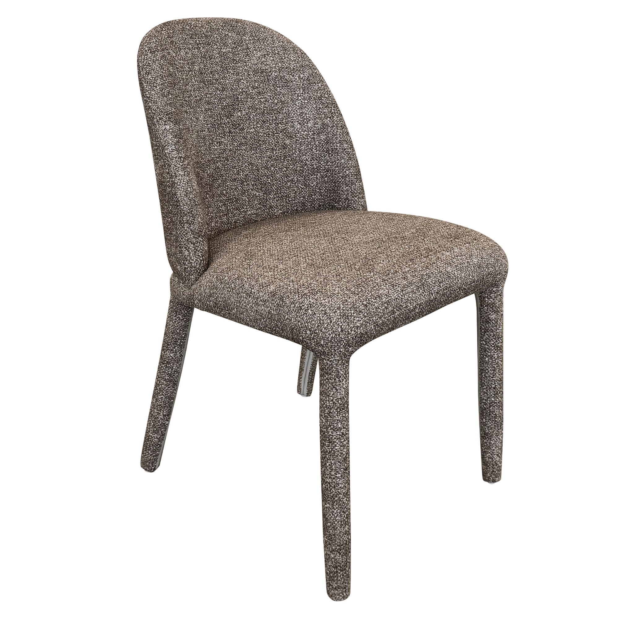 Angled view of the dark brown Myla dining chair highlighting its continuous upholstered silhouette and plush textured fabric.