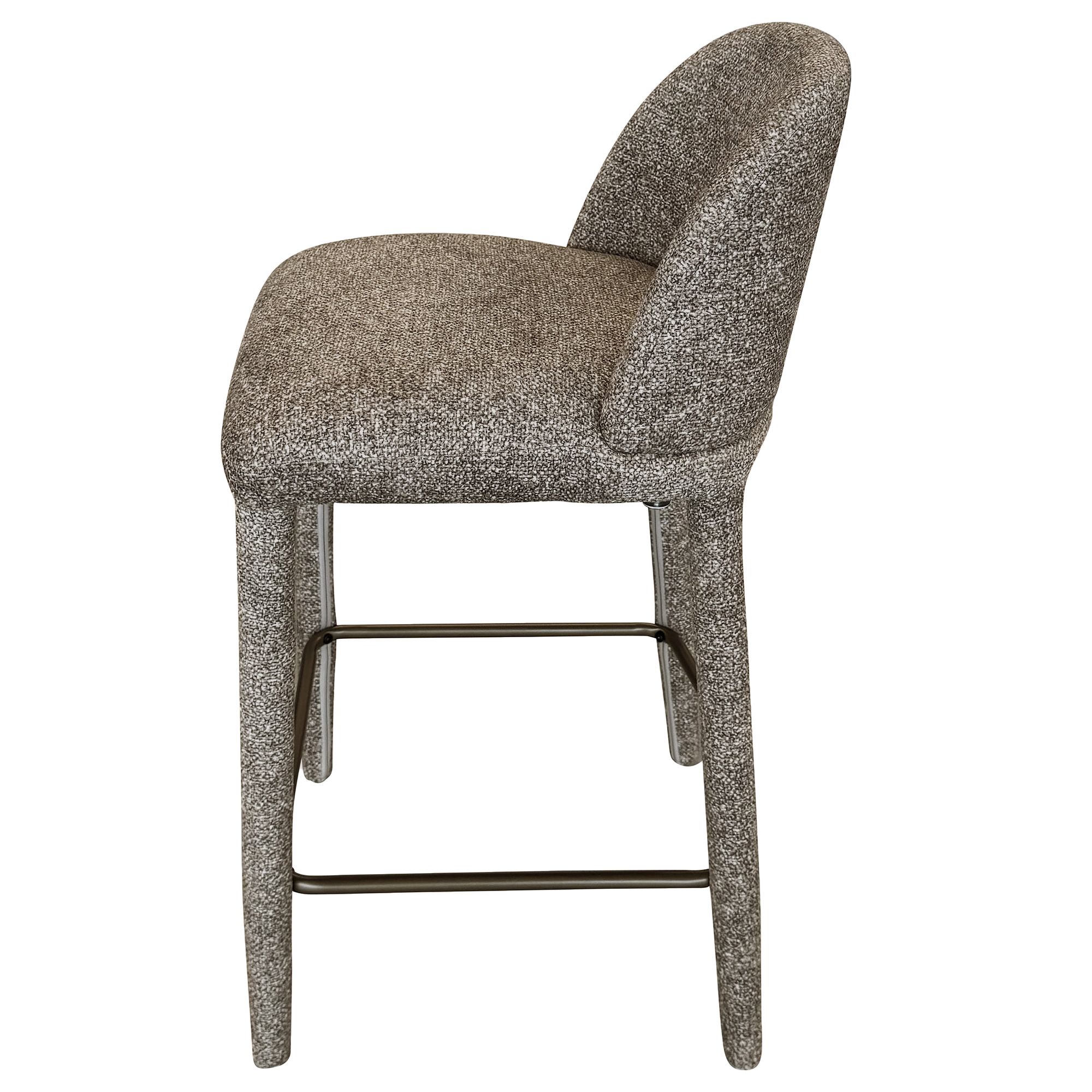 Side profile view of the Myla light grey counter stool highlighting its thick seat and sturdy fabric-wrapped legs.