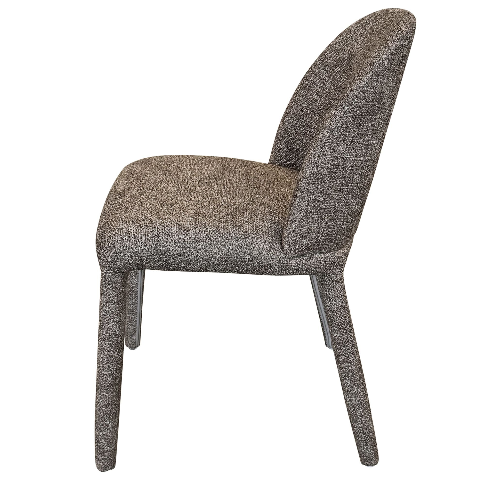 Side profile view of the dark brown Myla dining chair showcasing its curved hugging backrest and sturdy fabric-wrapped legs.
