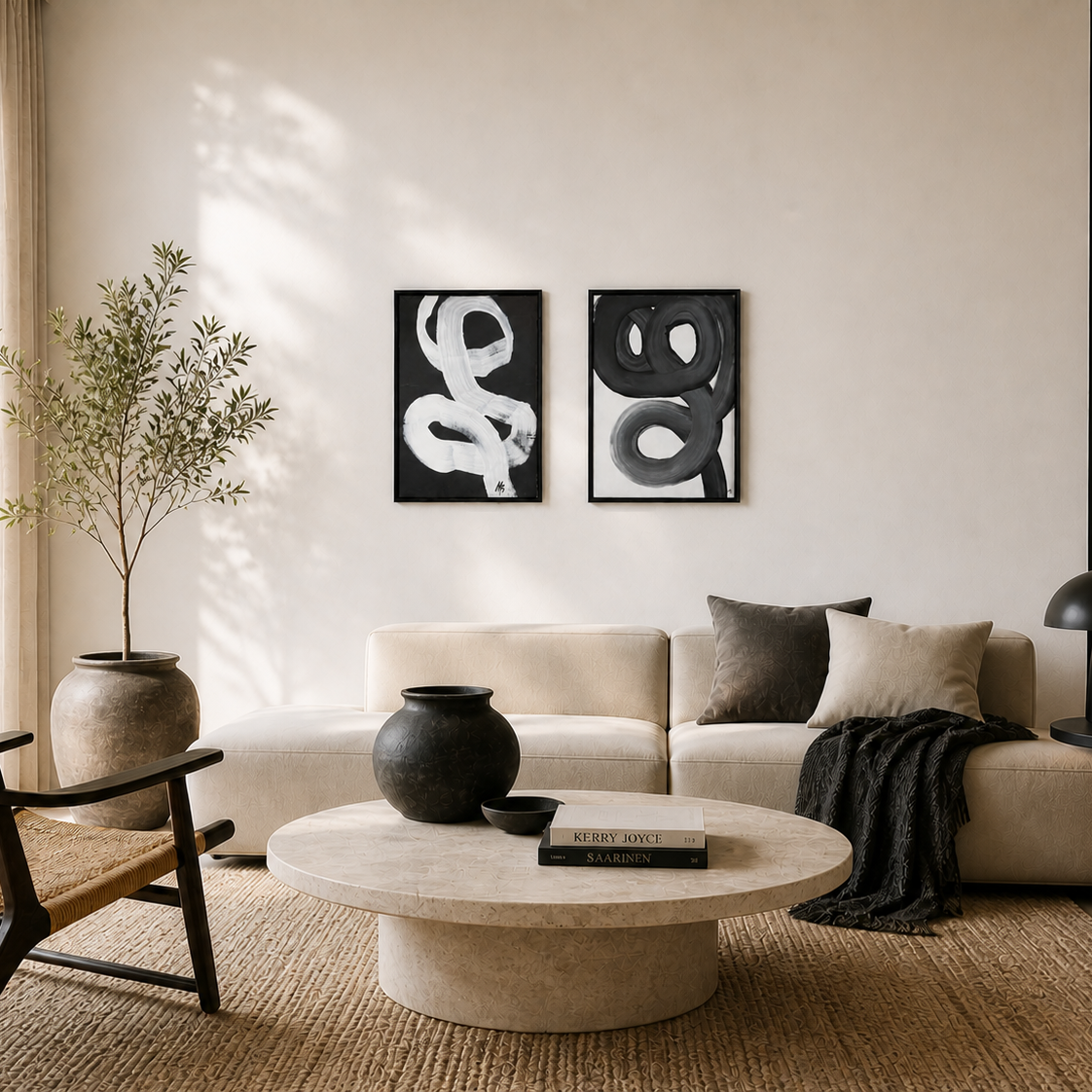 Modern living room with a beige sofa, round coffee table, and decorative wall art.