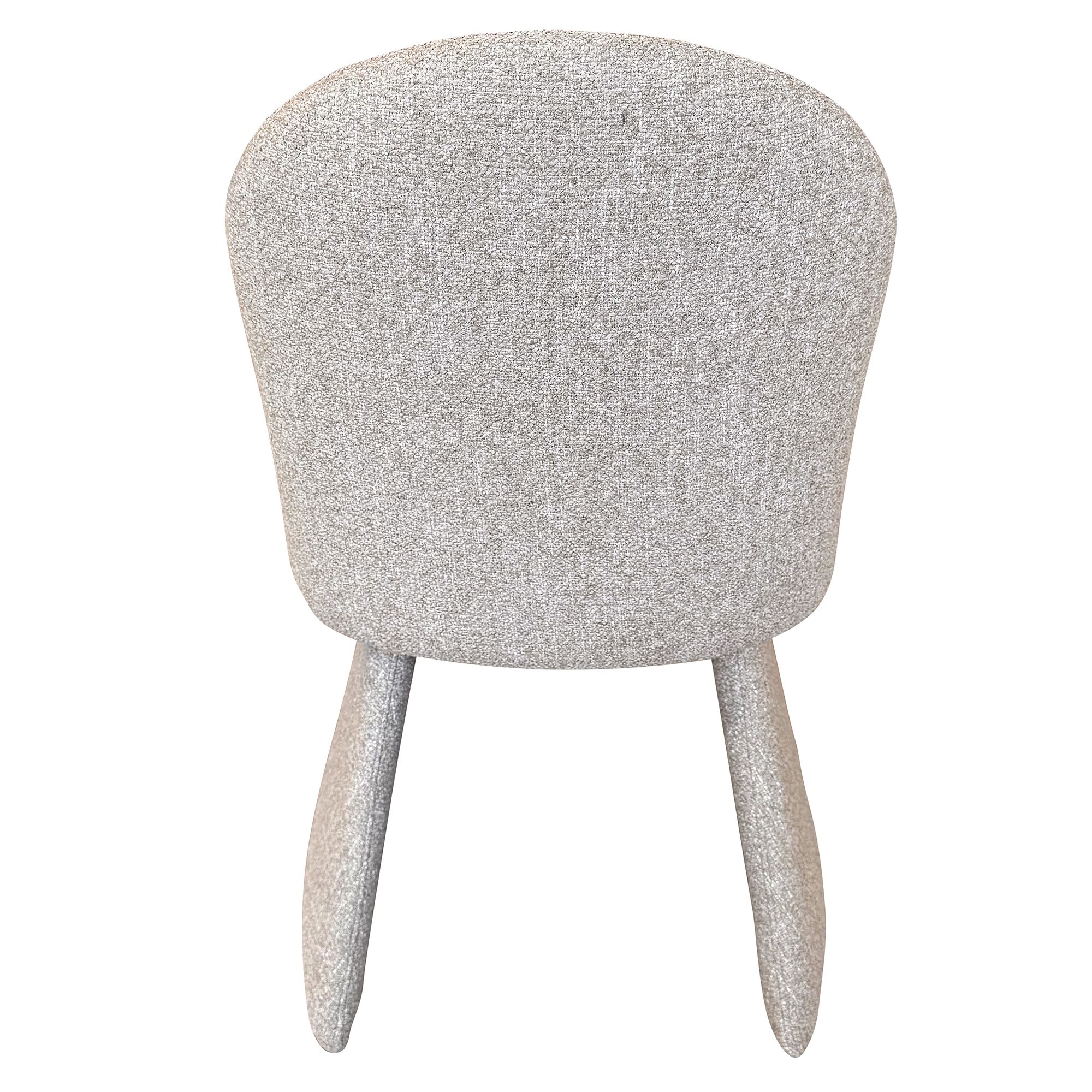 Full back view of the Odette chair against a white background, emphasizing its clean lines and minimalist form.