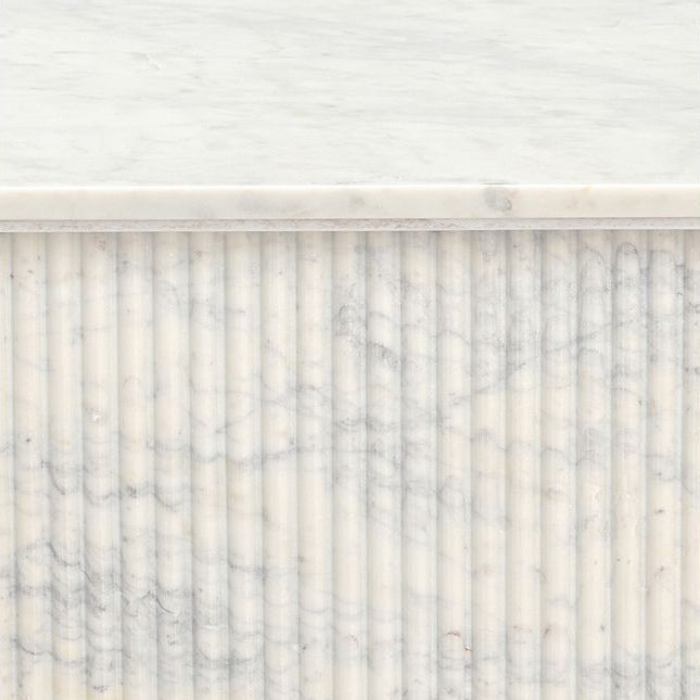 Close-up of the thickness of the Ophelia Marble Coffee Table