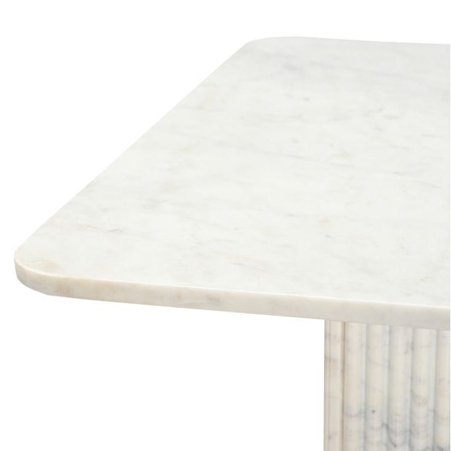Corner view of the Ophelia Marble Coffee Table on a white background